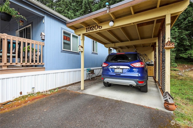 view of vehicle parking with a carport