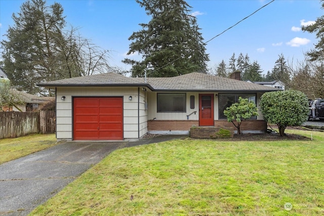 single story home featuring a garage and a front yard