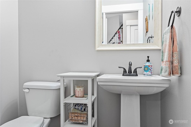 bathroom with toilet and sink