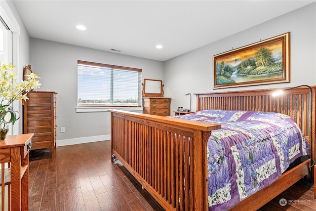 bedroom with dark wood-type flooring