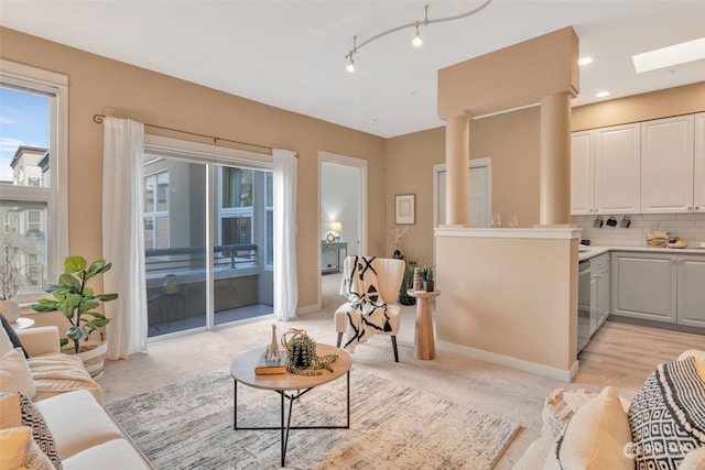 living room featuring a skylight