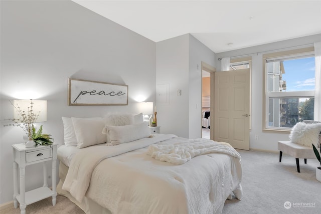 bedroom featuring light colored carpet