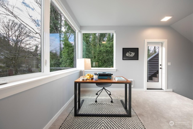 office space with carpet flooring and vaulted ceiling