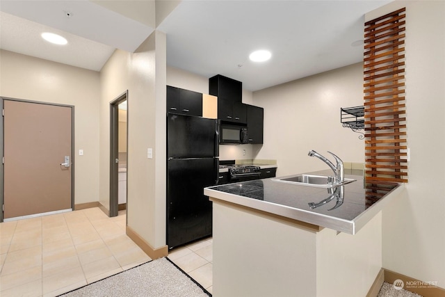 kitchen featuring sink, kitchen peninsula, a breakfast bar area, light tile patterned flooring, and black appliances