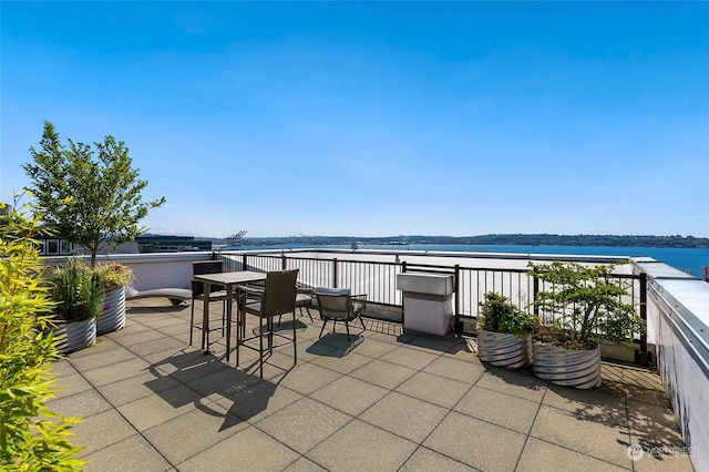 view of patio featuring a water view