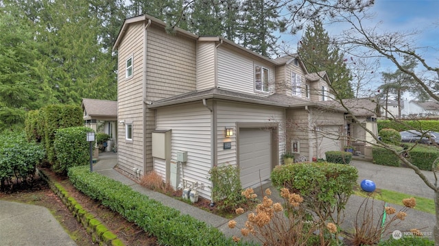 view of property exterior with a garage