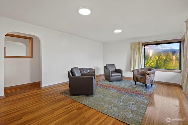 living area with hardwood / wood-style flooring