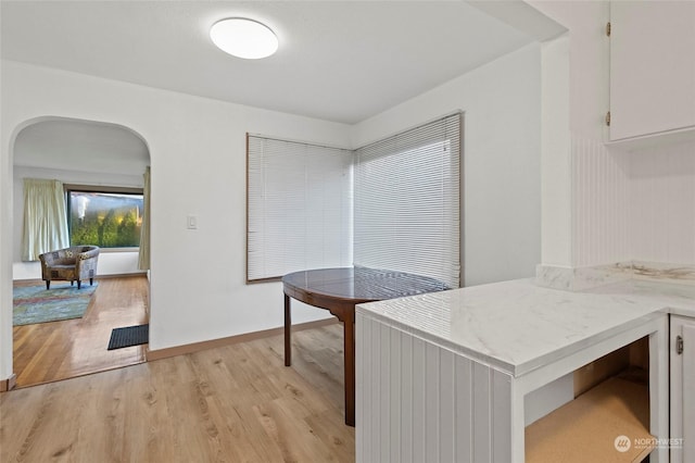 kitchen featuring white cabinetry and light hardwood / wood-style flooring