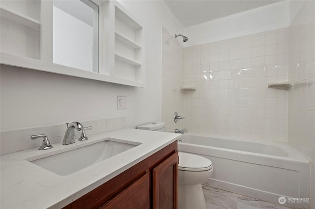 full bathroom with vanity, toilet, and tiled shower / bath combo