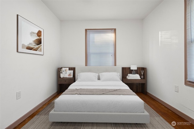 bedroom with hardwood / wood-style floors