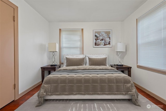 bedroom with hardwood / wood-style floors