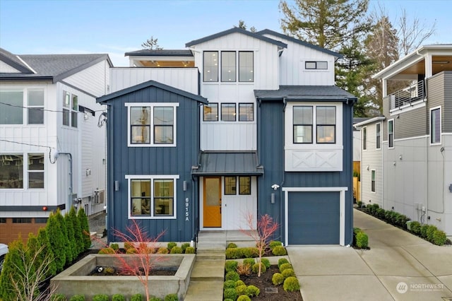 view of front of home featuring a standing seam roof, driveway, board and batten siding, and an attached garage