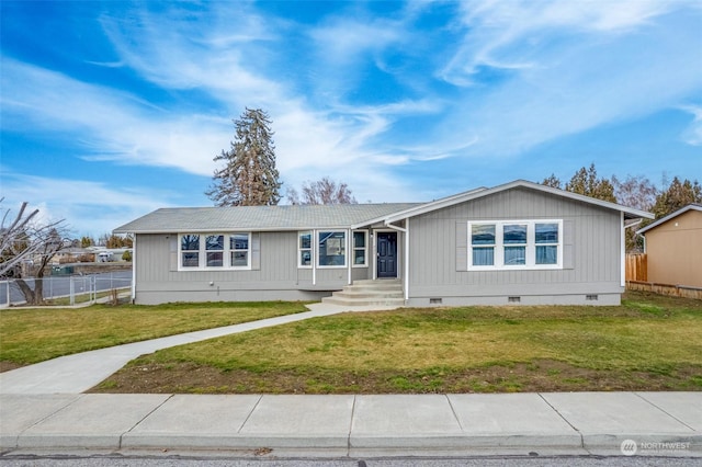 ranch-style house featuring a front lawn