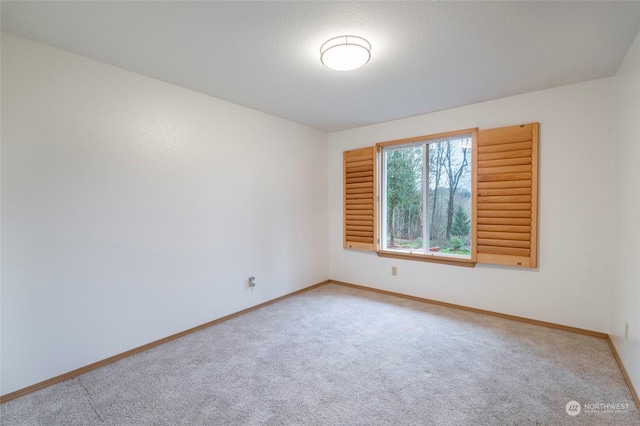 spare room with carpet flooring