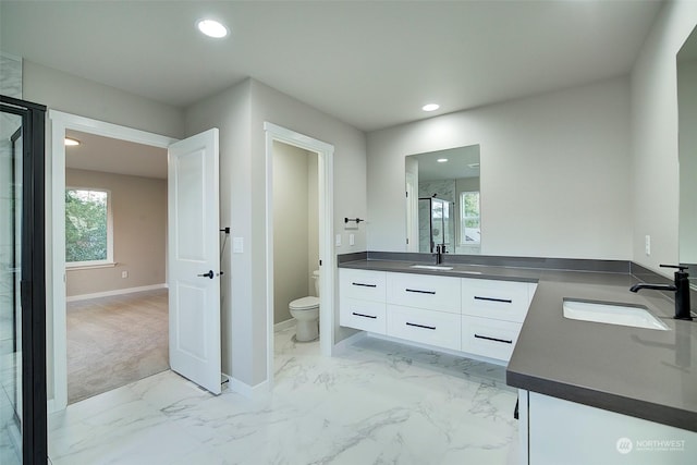 bathroom featuring baseboards, toilet, recessed lighting, marble finish floor, and vanity