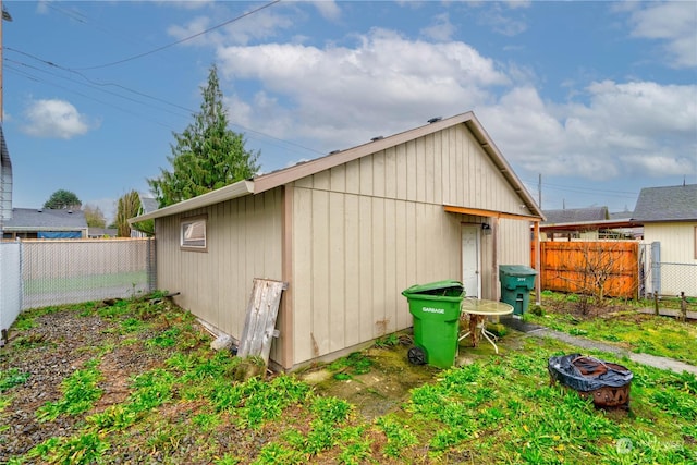 view of outbuilding featuring an outdoor fire pit