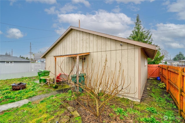 view of outbuilding featuring an outdoor fire pit