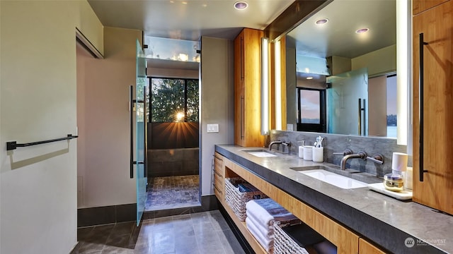 bathroom with tile patterned flooring, decorative backsplash, and vanity