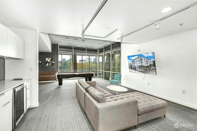 living room featuring carpet flooring, floor to ceiling windows, beverage cooler, and pool table