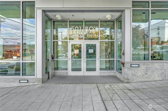 view of exterior entry featuring french doors