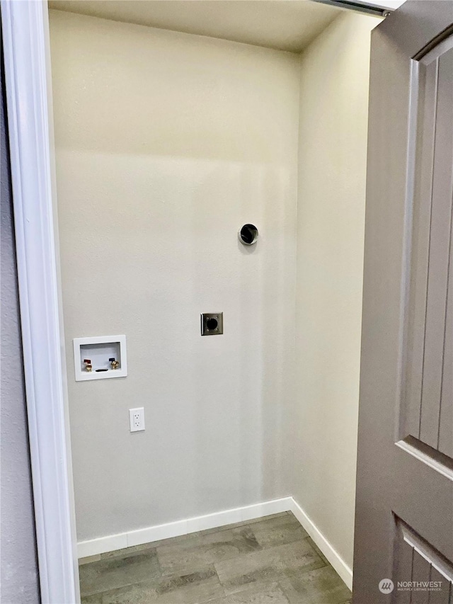 laundry area with hardwood / wood-style floors, hookup for a washing machine, and hookup for an electric dryer