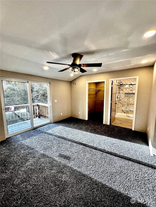 spare room featuring ceiling fan, carpet floors, and a textured ceiling