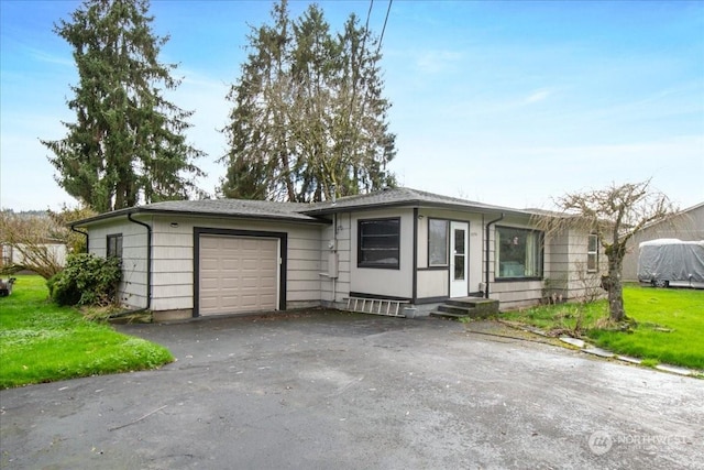 single story home with a garage