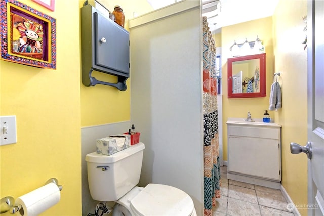 bathroom with tile patterned floors, vanity, and toilet