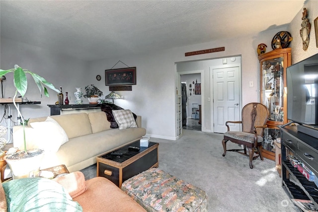 living room with light colored carpet and a textured ceiling