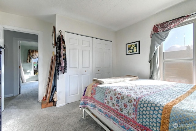 carpeted bedroom with a closet