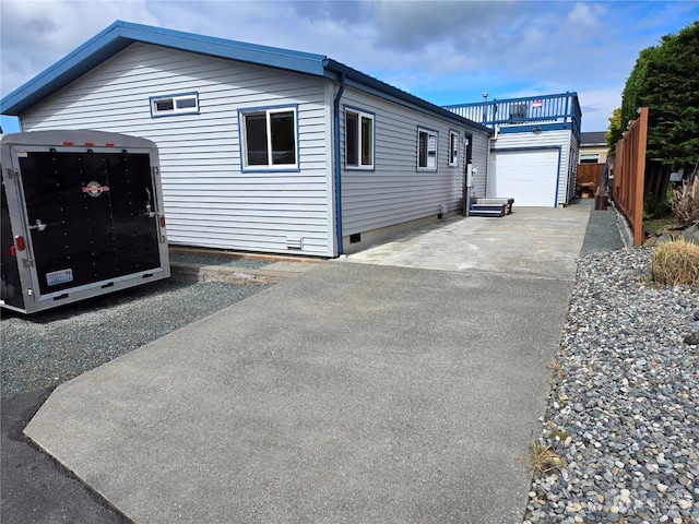 view of side of home featuring a garage