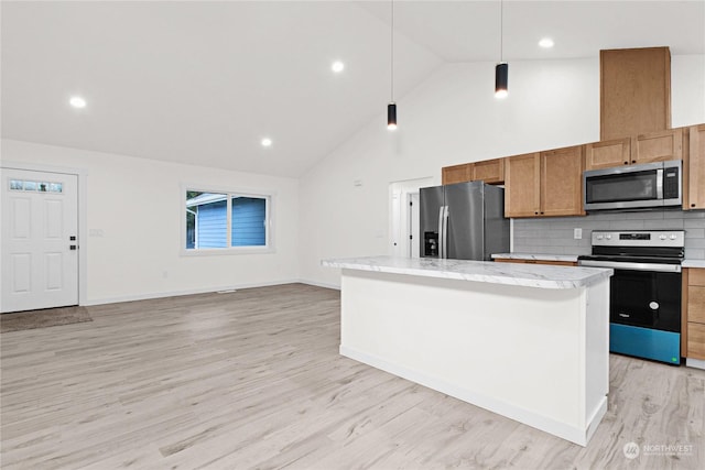 kitchen featuring pendant lighting, a center island, high vaulted ceiling, decorative backsplash, and stainless steel appliances