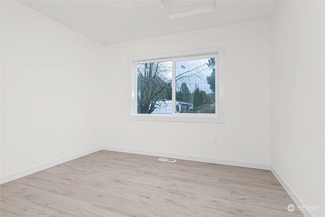 unfurnished room featuring light hardwood / wood-style flooring