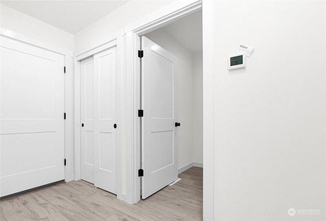 hallway featuring light hardwood / wood-style flooring