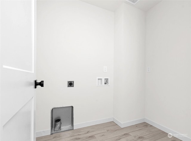 washroom featuring hookup for an electric dryer, hookup for a washing machine, and light hardwood / wood-style flooring