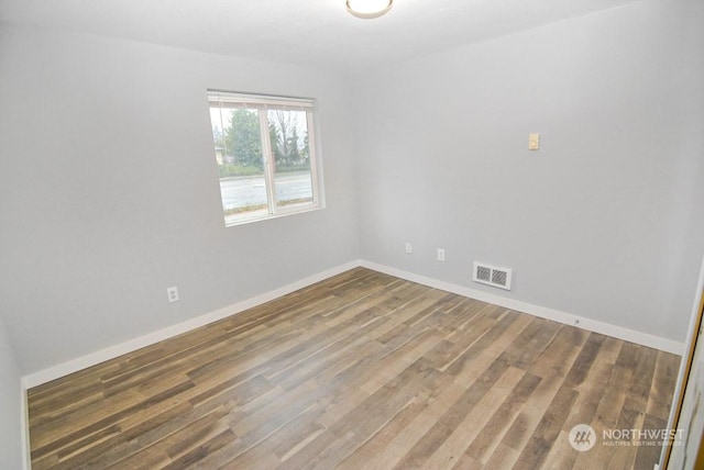 empty room featuring hardwood / wood-style floors