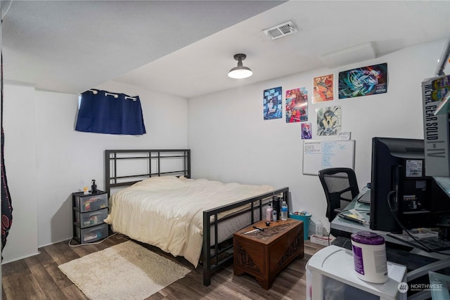 bedroom featuring dark wood-type flooring