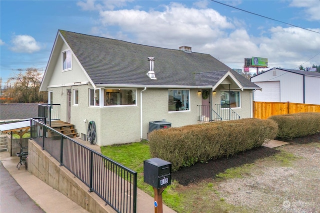 view of front of property with central AC unit