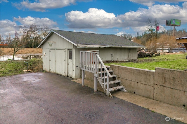 exterior space with a lawn and a storage unit