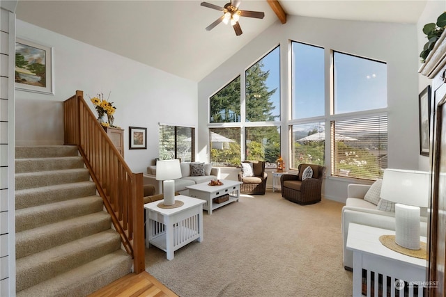 living room with hardwood / wood-style flooring, ceiling fan, beam ceiling, and high vaulted ceiling