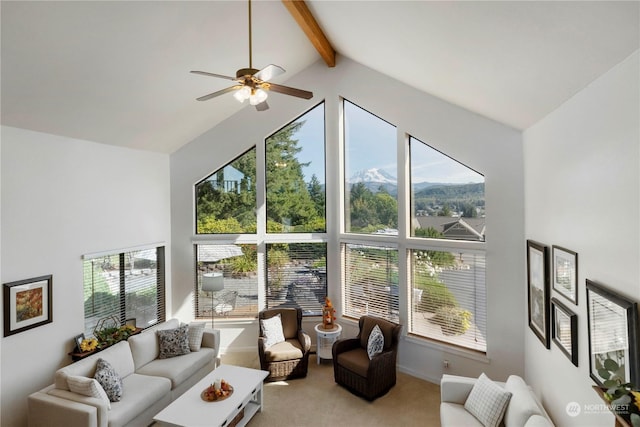 living room featuring a mountain view, high vaulted ceiling, carpet flooring, ceiling fan, and beamed ceiling