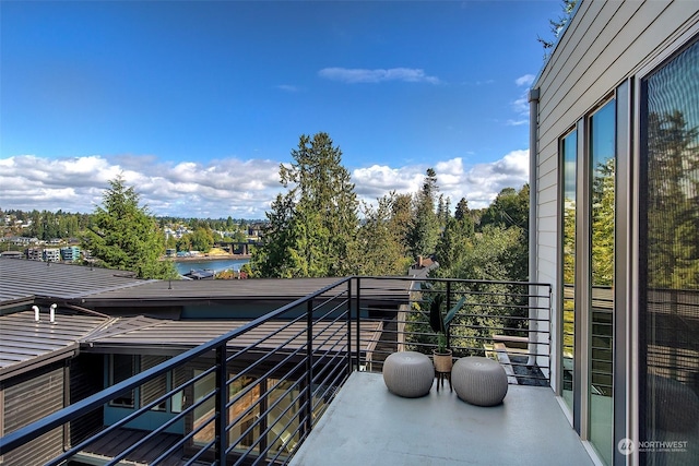 balcony featuring a water view