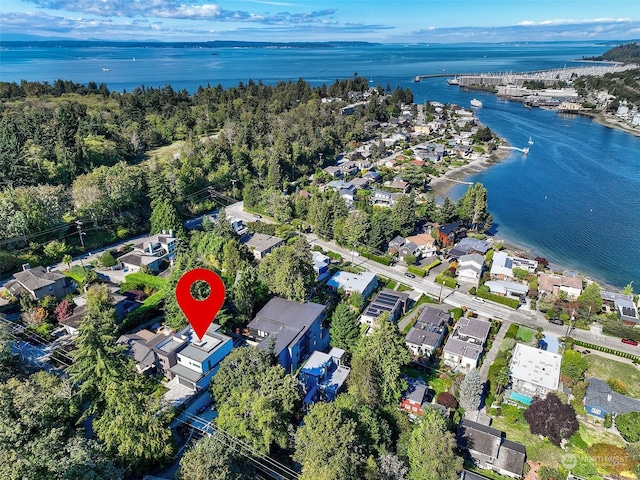 birds eye view of property with a water view