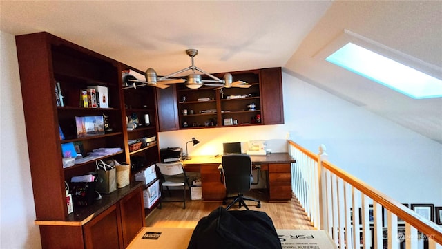 office area featuring light hardwood / wood-style flooring and built in desk