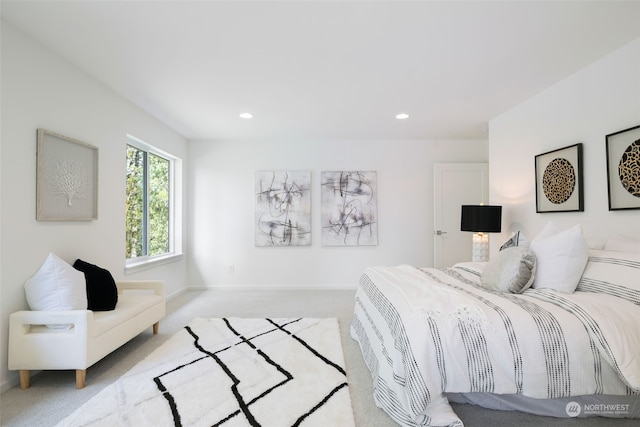 bedroom featuring light colored carpet