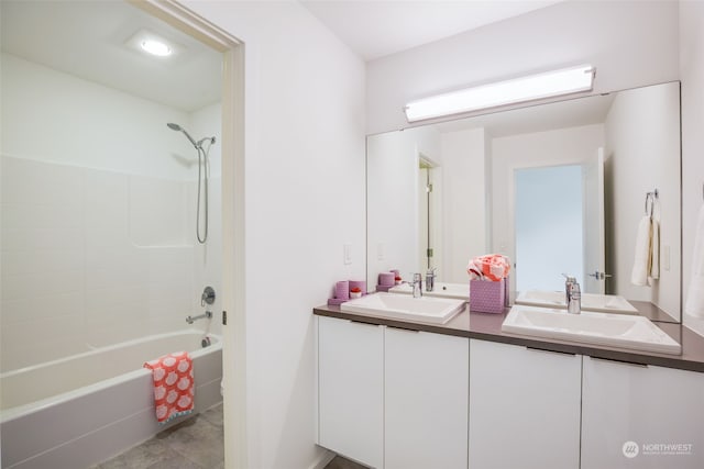 bathroom featuring vanity and  shower combination