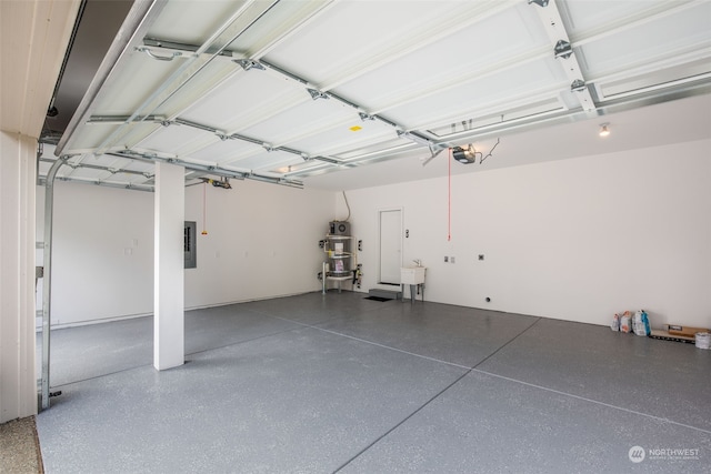 garage featuring a garage door opener and electric panel