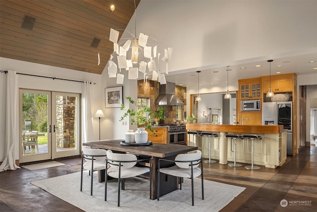 dining space featuring french doors, an inviting chandelier, high vaulted ceiling, and wood ceiling