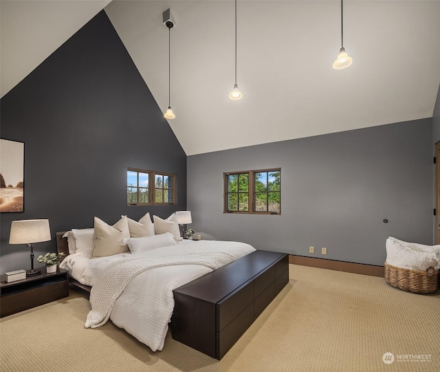 bedroom featuring high vaulted ceiling