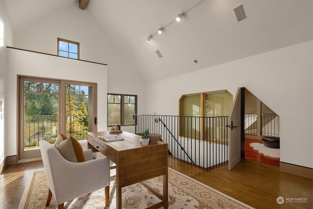 interior space with beamed ceiling and high vaulted ceiling